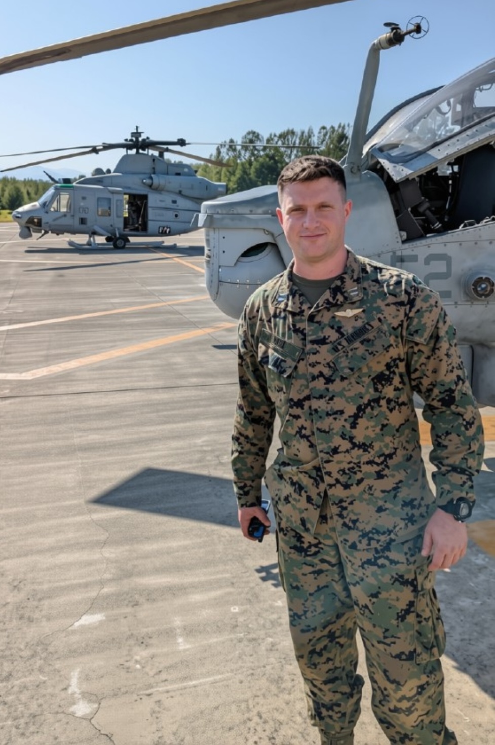 Daniel Holz in uniform on an aviation flight line.